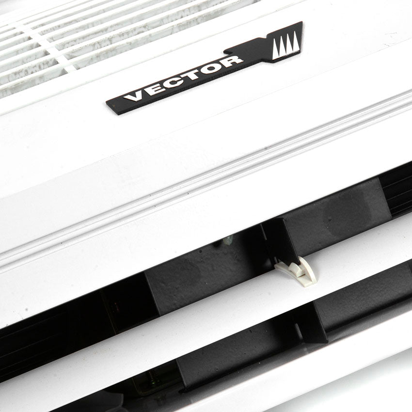 Close-up of a Vector air conditioning unit with a focus on the brand logo.