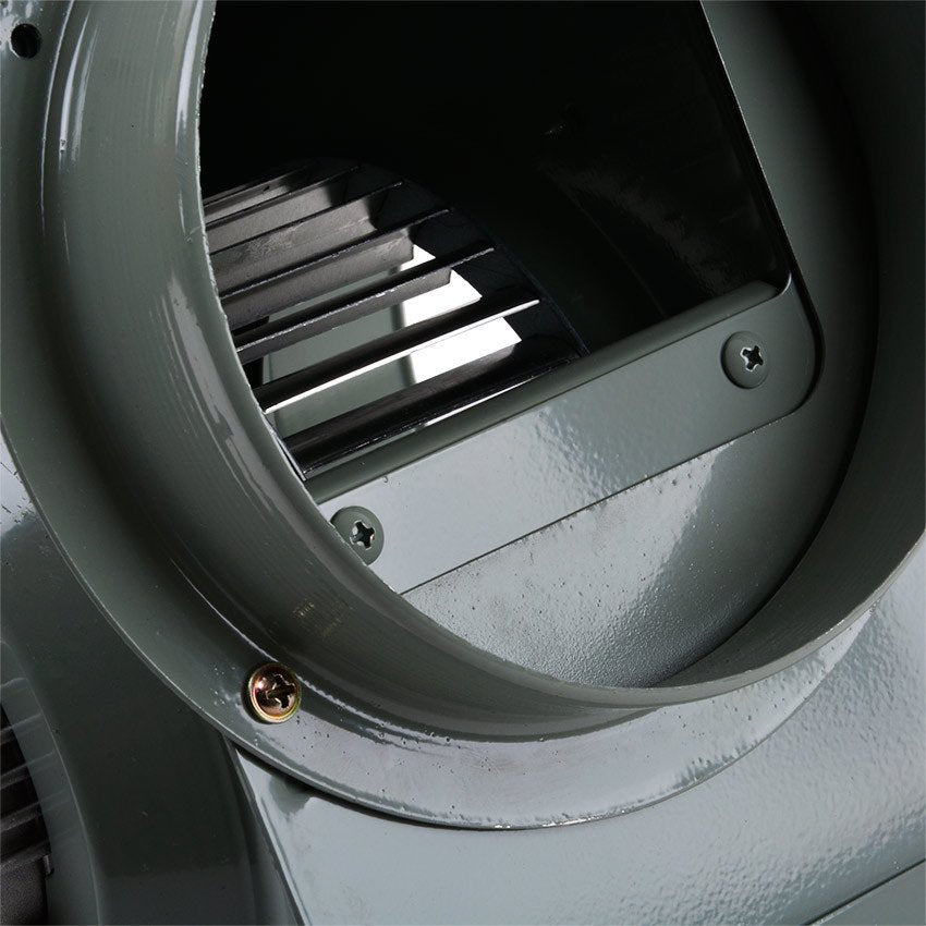 Close-up of a metallic fan blade inside a circular metal housing.